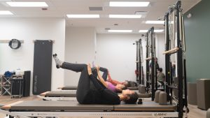 Pilates and physiotherapy client experiencing chronic pain relief in East Van clinic.” 