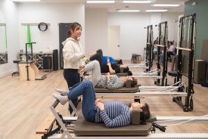 Reformer Pilates session in East Vancouver for injury recovery and chronic pain relief.