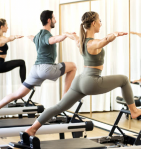 Reformer Pilates session for desk job posture improvement in Vancouver clinic